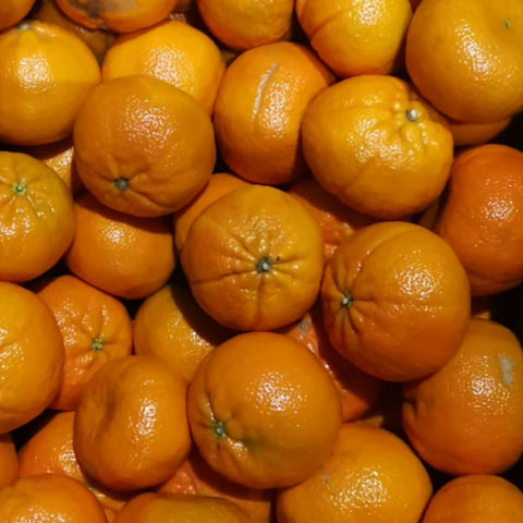A Large Stack Of Ripe Fresh Organic Oranges